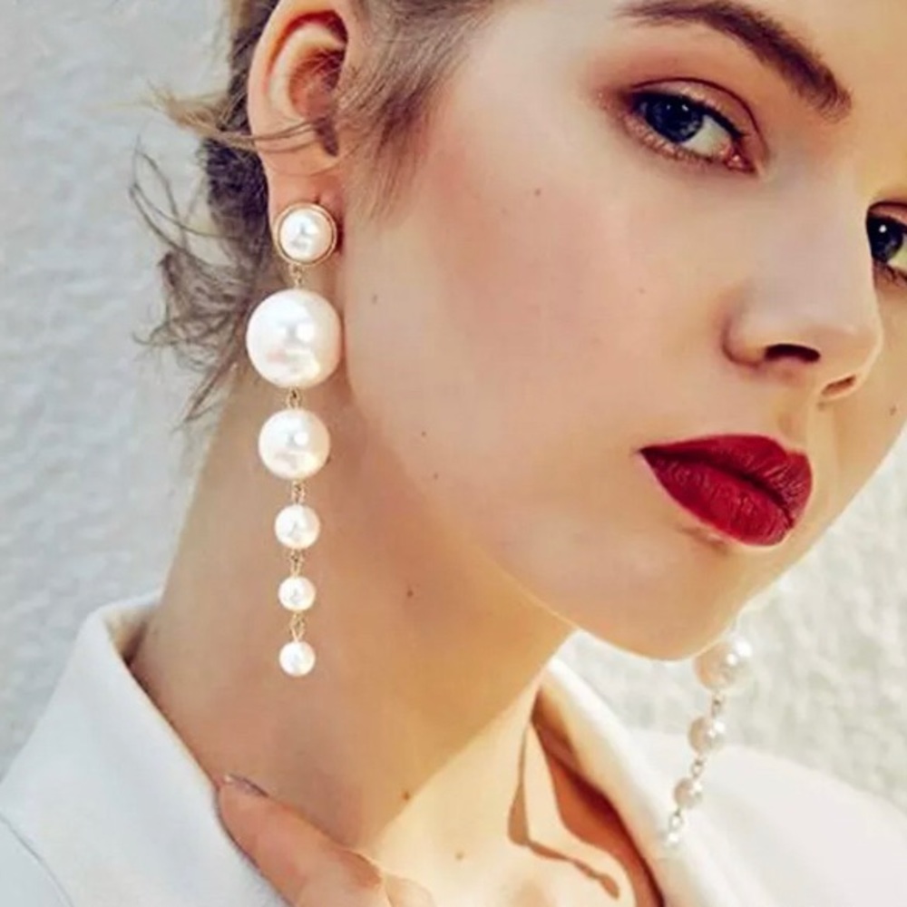 Long white and gold pearl drop statement earrings